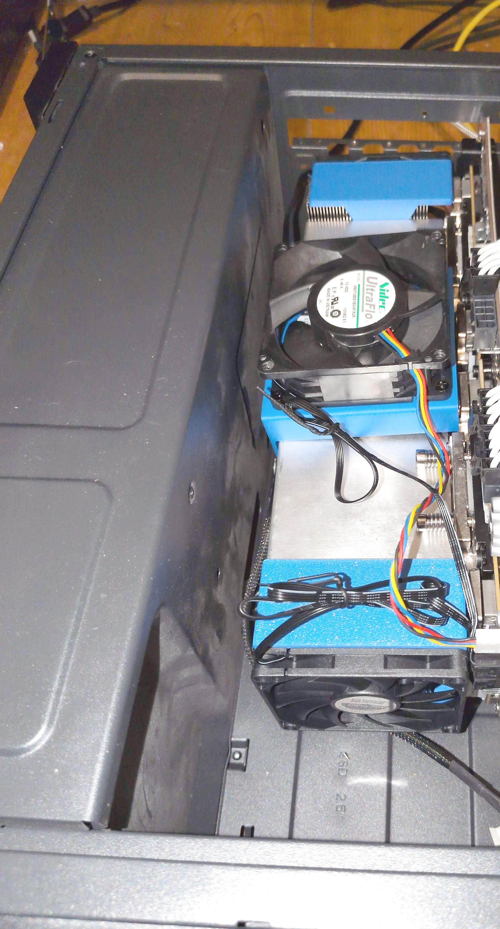 Two V100s stacked on the NVLink carrier, installed in the box